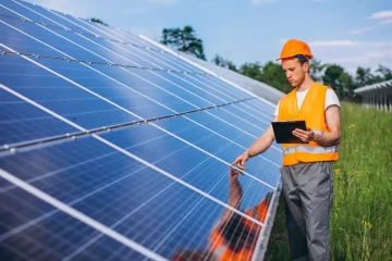 man-worker-in-the-firld-by-the-solar-panels-1-1024x683.jpg